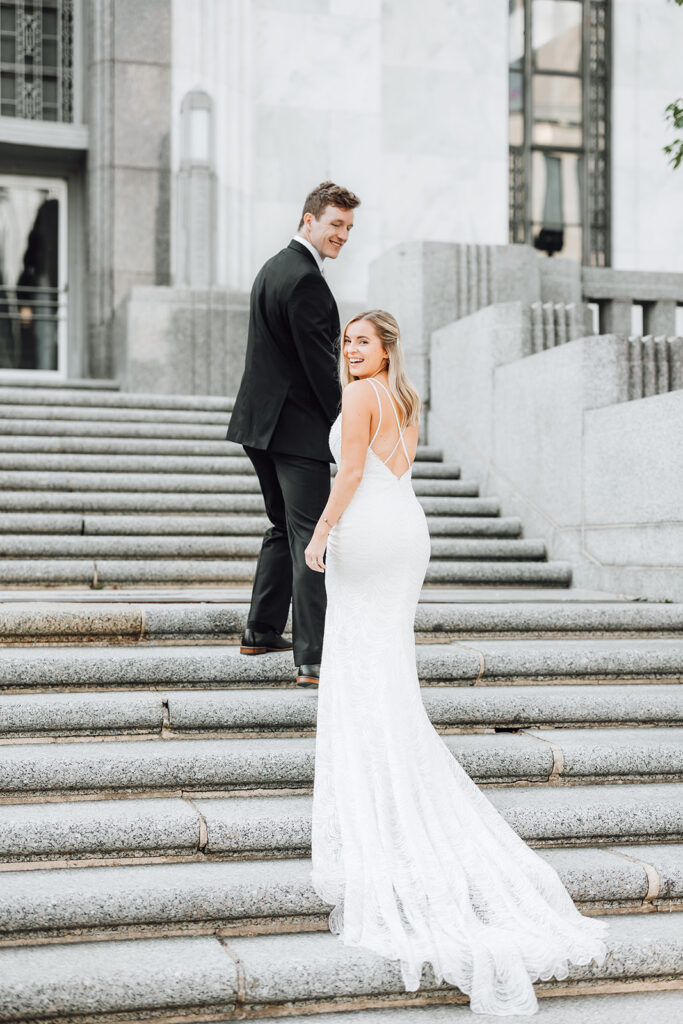 Bride and groom walking up stairs near the Grand Hyatt Nashville