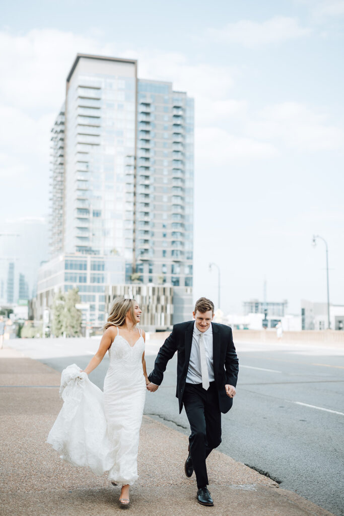bride and groom strolling down the street near Grand Hyatt Nashville