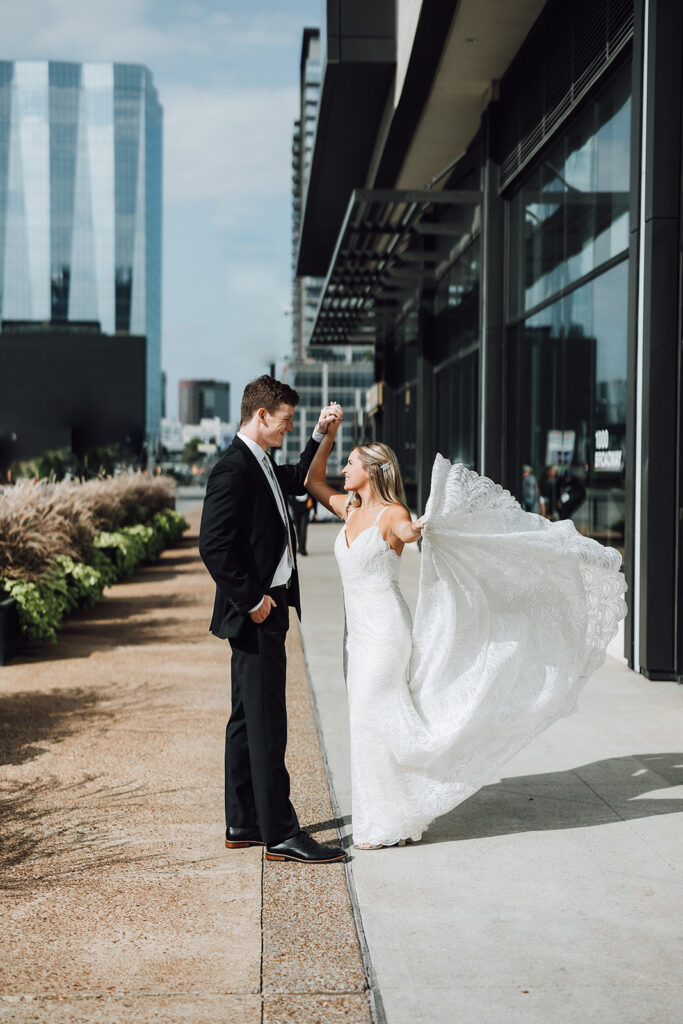 Bride and groom dancing in the street near Grand Hyatt Nashville