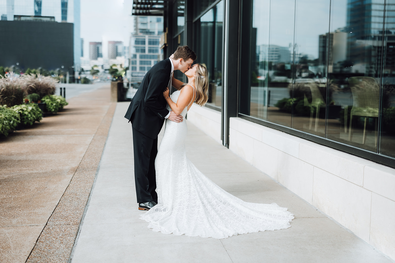 groom dipping his bride outside the Grand Hyatt Nashville