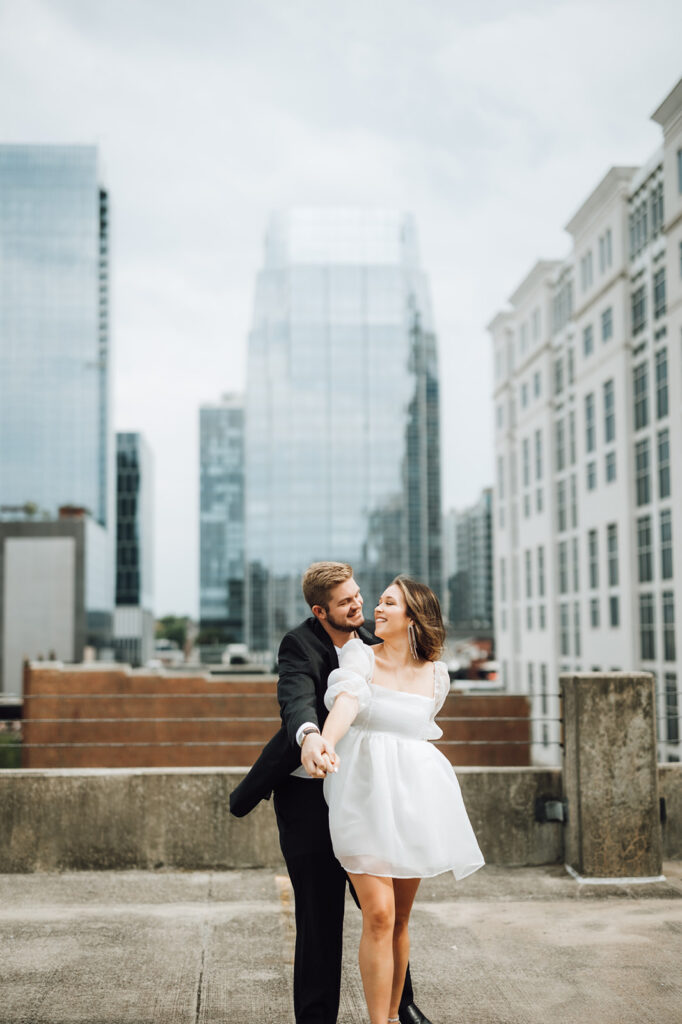 bride and groom dancing on a rooftop near nashville