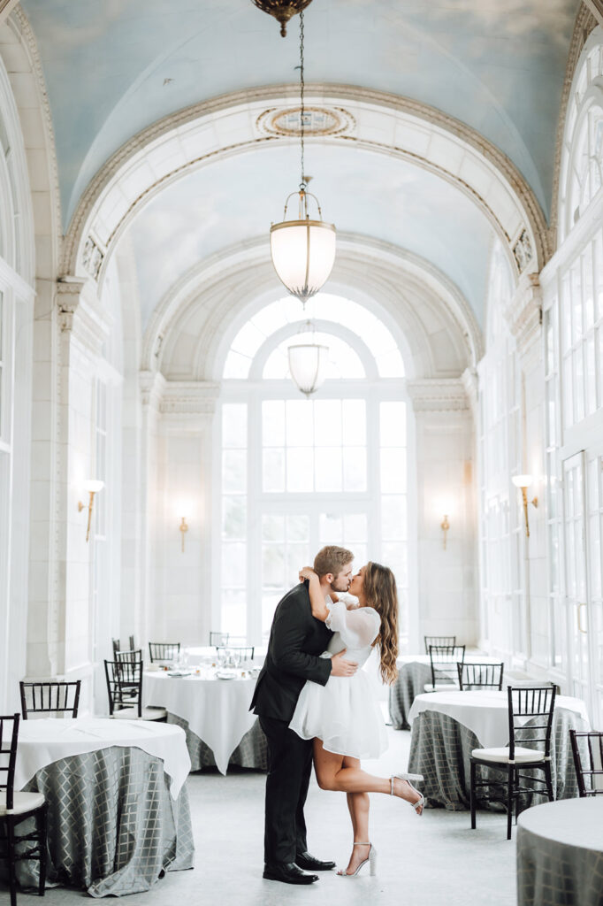 bride and groom sharing a kiss in the dining hall of the The Hermitage Hotel Wedding venue