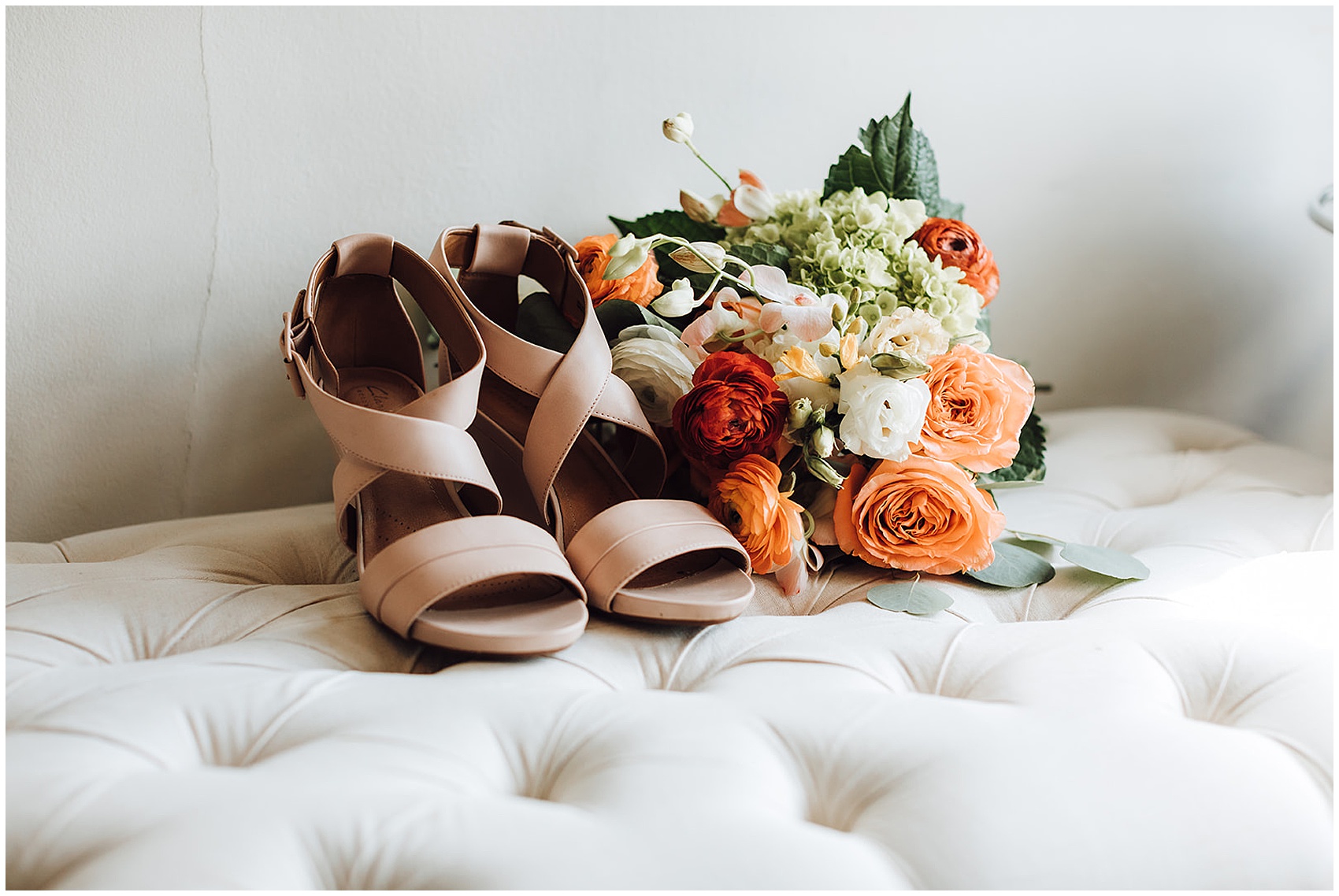 bride's shoes and bouquet at CJ's Off the Square wedding venue
