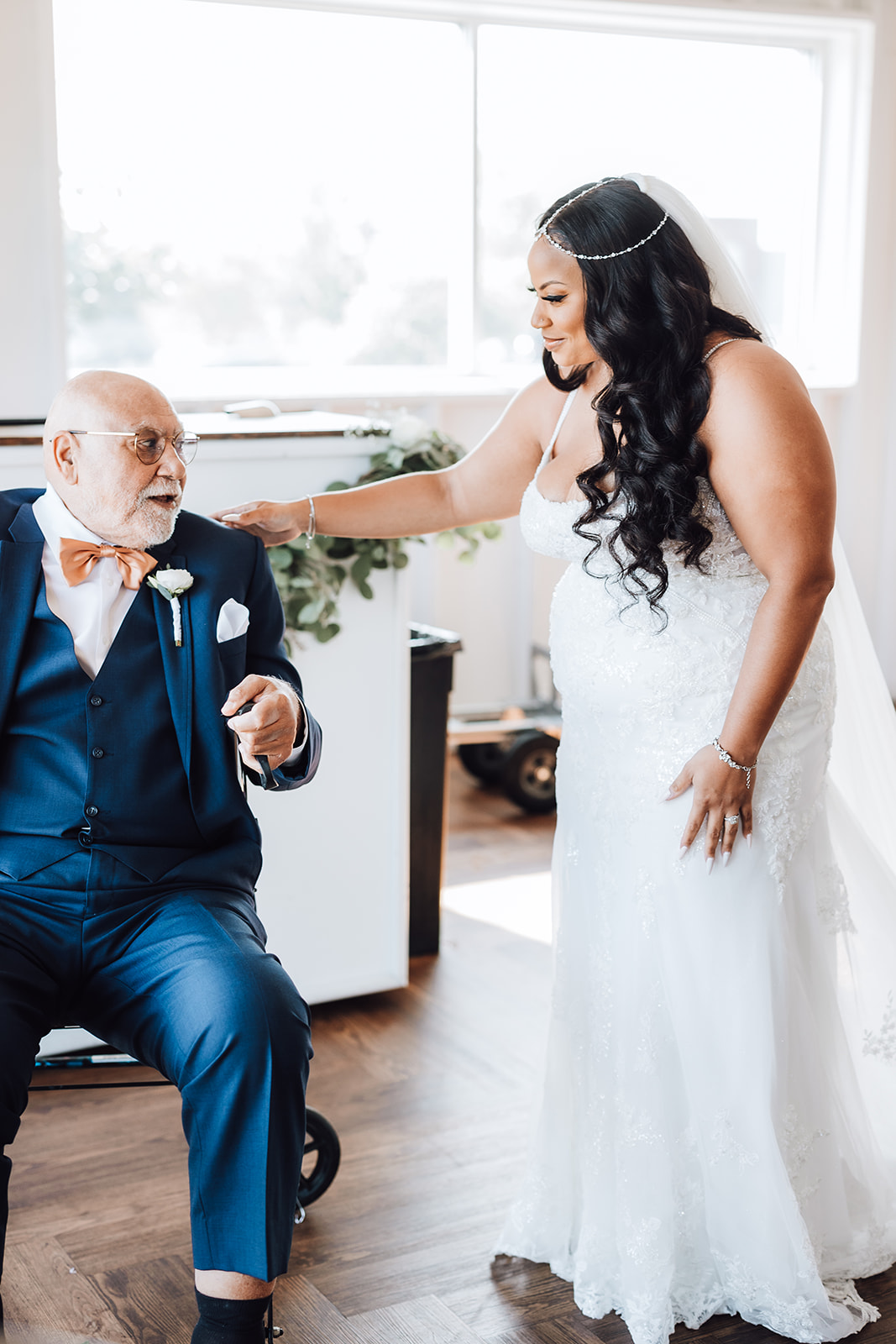 A bride surprises her dad for a first look in a large room 14Tenn Wedding
