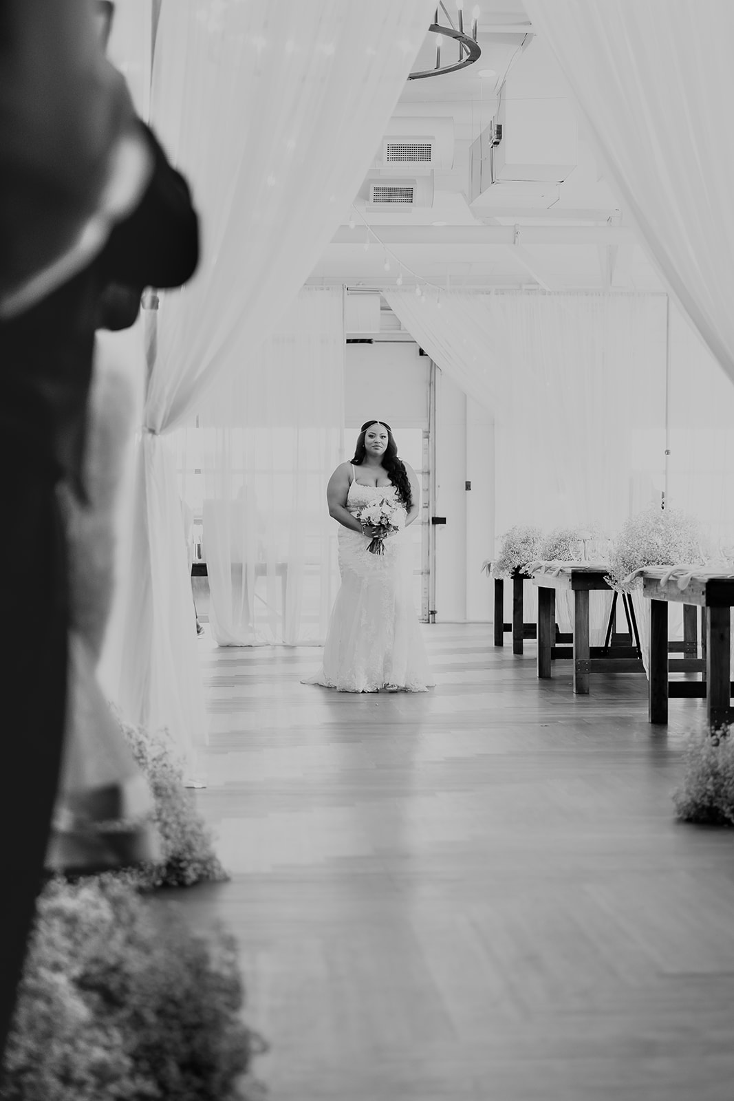 A bride prepares to walk down the aisle of her wedding