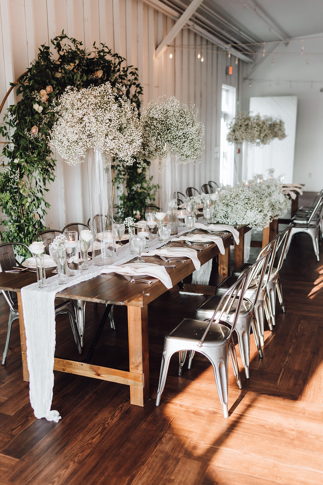 Details of a long wedding reception table with white linen and flowers 14Tenn Wedding