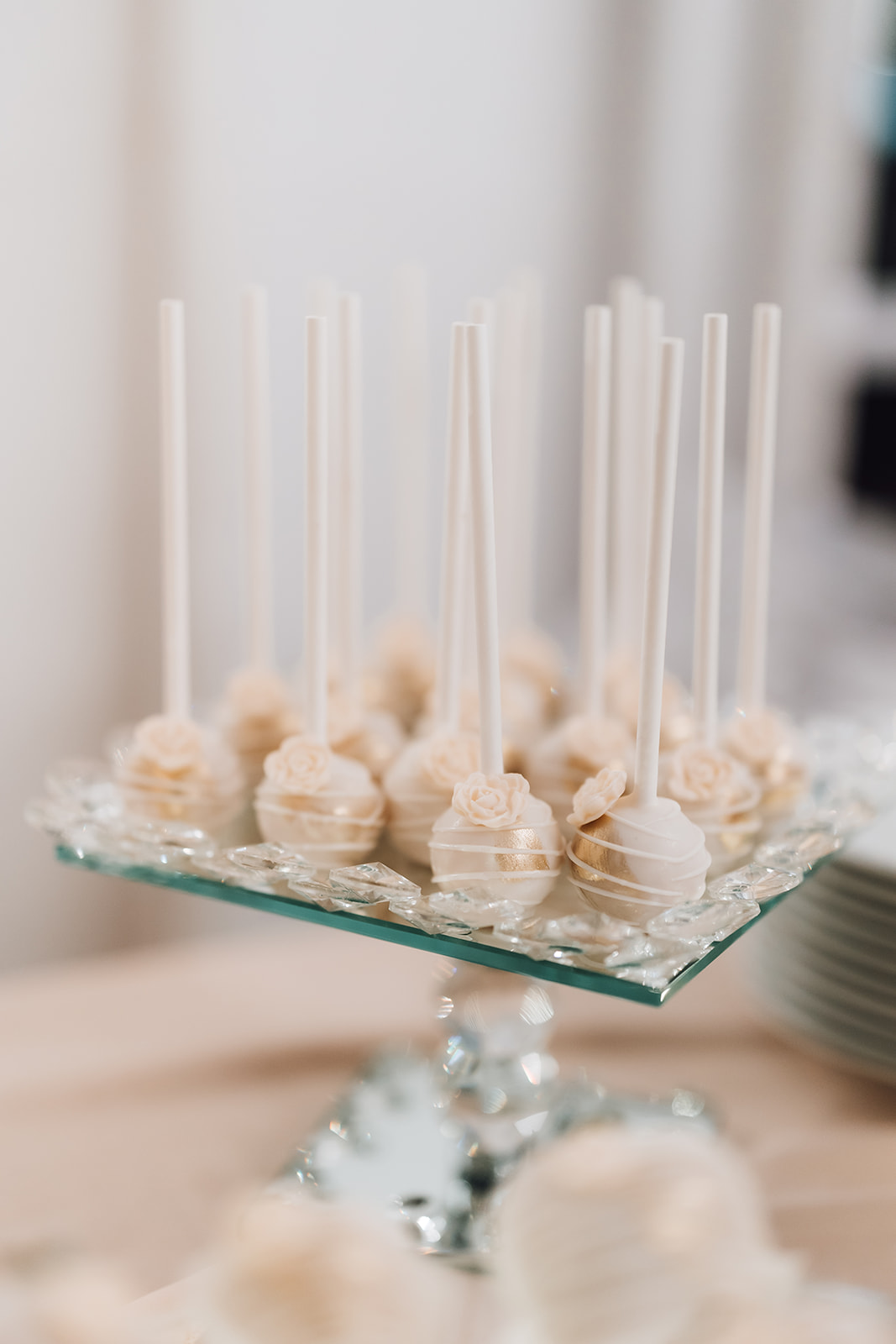 Details of rose gold cake pops on a glass stand 14Tenn Wedding